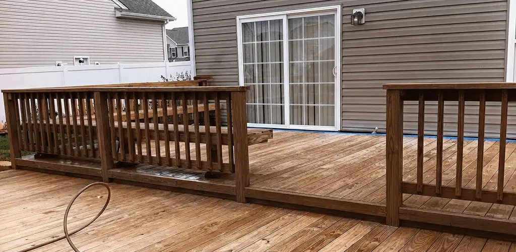 Deck sealing service protecting a backyard wood deck and railings in Glendale, AZ