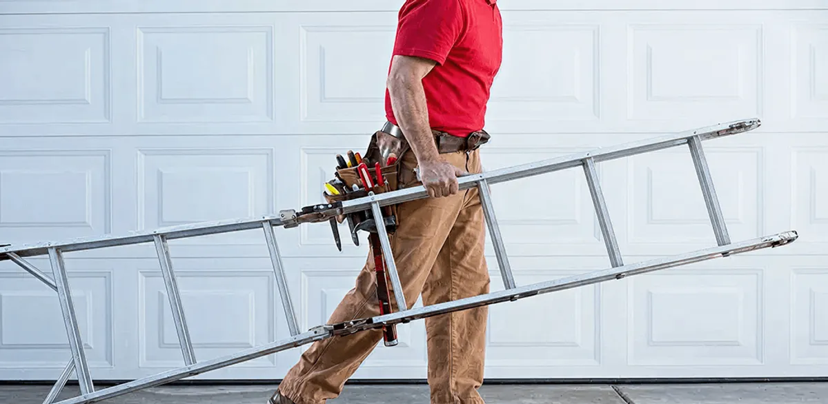 Garage door repair technician arriving with tools and ladder in Glendale, AZ