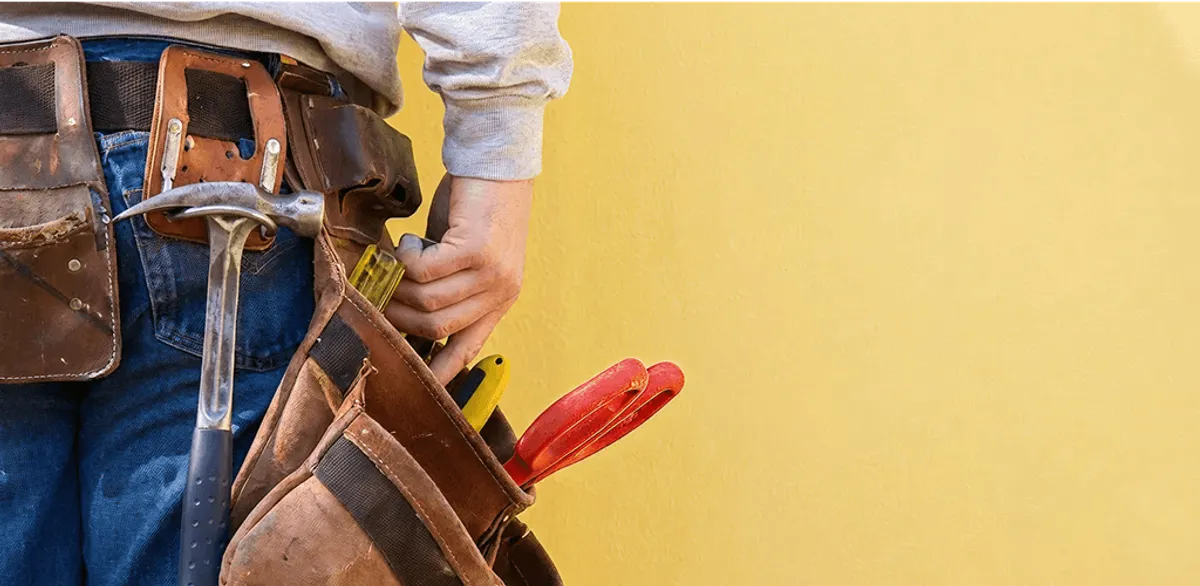Handyman with tool belt ready for home repairs and maintenance in Glendale, AZ